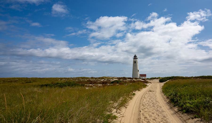 Dirt road that leads to a lighthouse in Nantucket