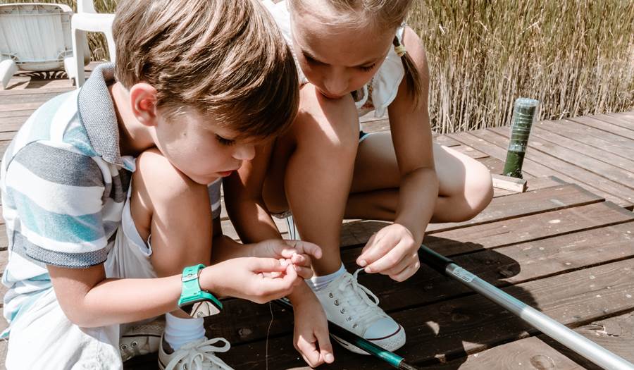 Kids setting up a fishing line